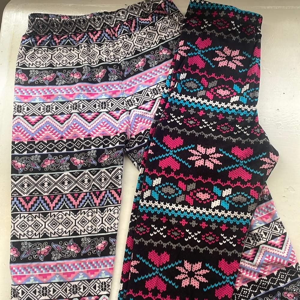 Two pairs Agnes & Dora S/M adult leggings fit US sizes 4-12. Near new condition